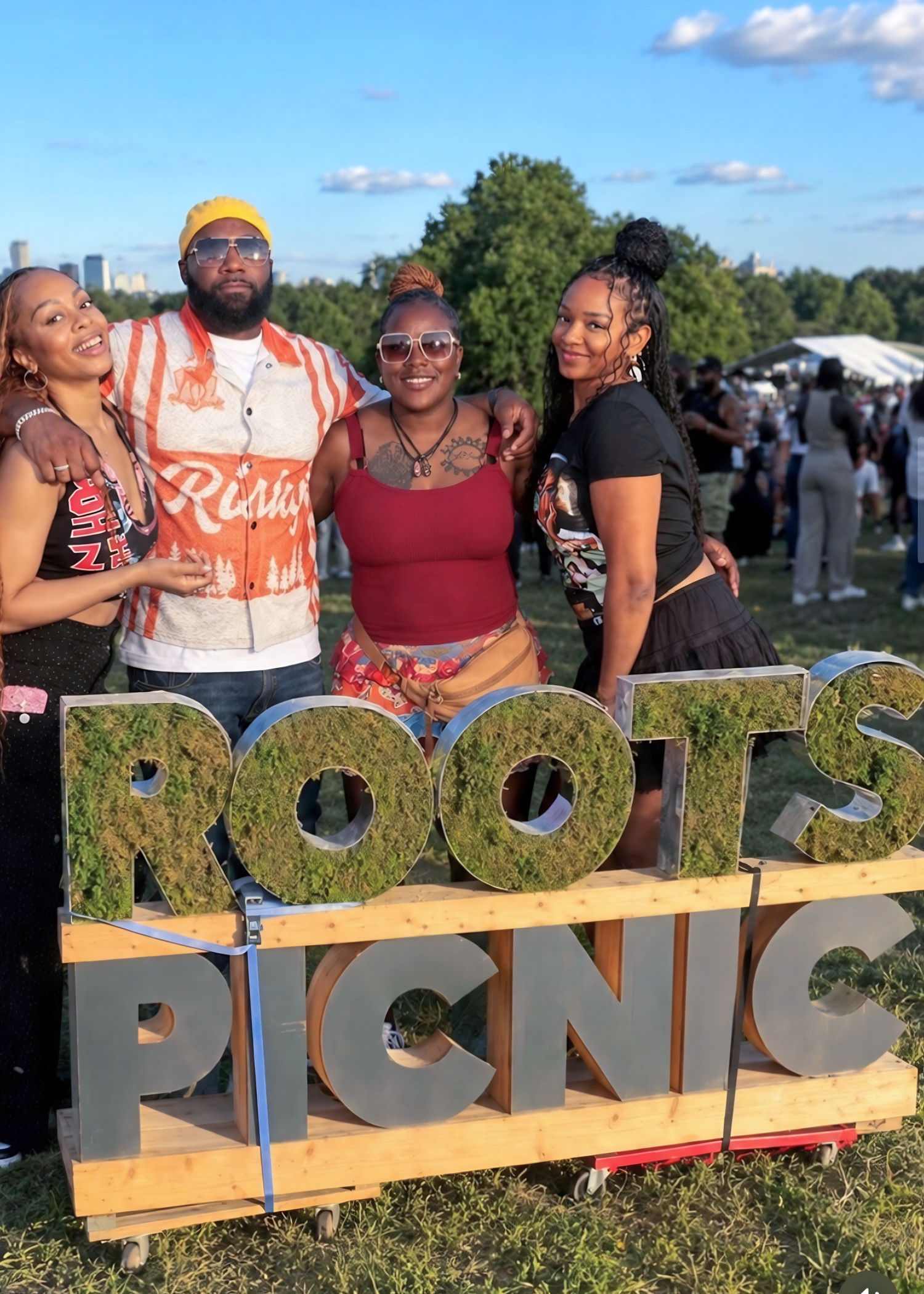 Roots Picnic fashion featuring a retro-inspired bowling shirt, golden headwrap, and classic festival streetwear.