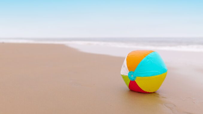 Lone beach ball on the sand for Missed Connections Philadelphia July 2026