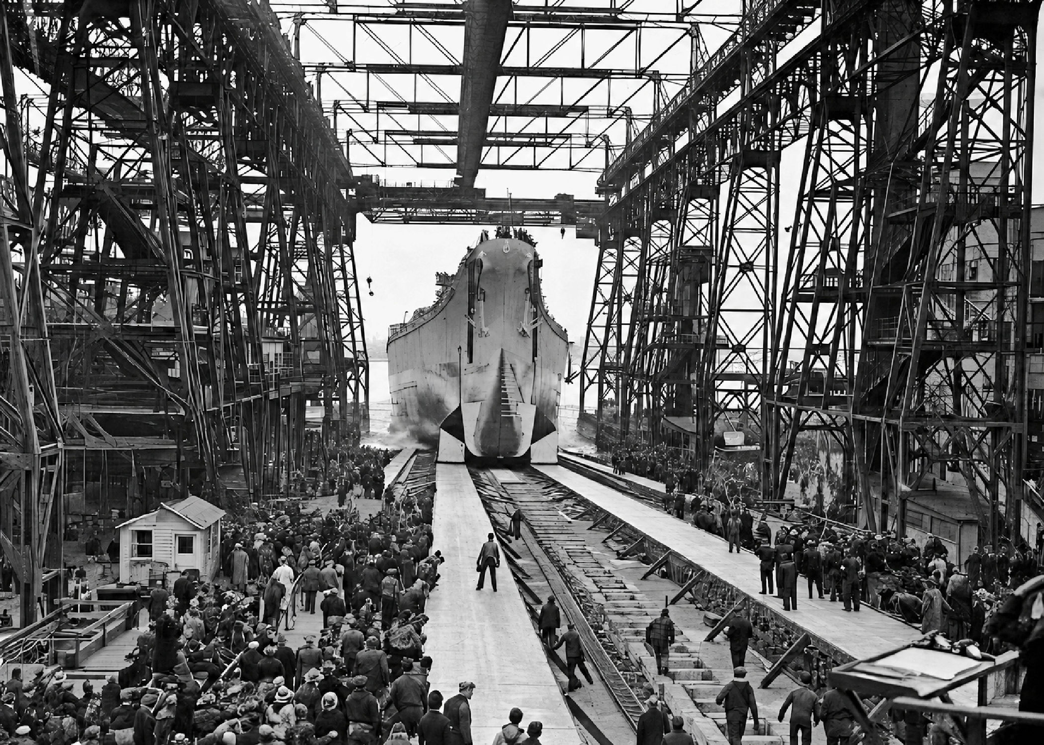 USS New Jersey launches from the Philadelphia Naval Shipyard on December 7, 1942, as crowds watch from the shipway.