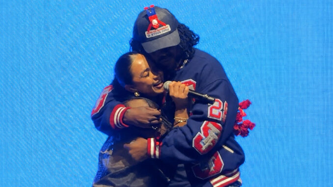 Sheryl Ann Padre sings with Wale onstage during “Fly Away” (May 2026)